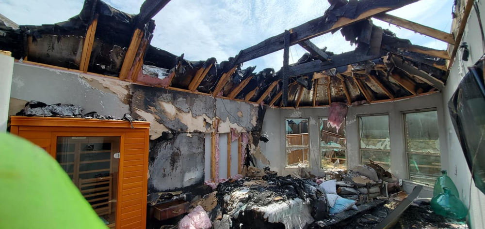 Fire Damage - Ravaged Home and Collapsed Roof