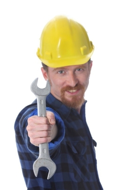 Construction worker holding a wrench Construction worker holding a wrench