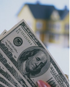 Holding $100 bills