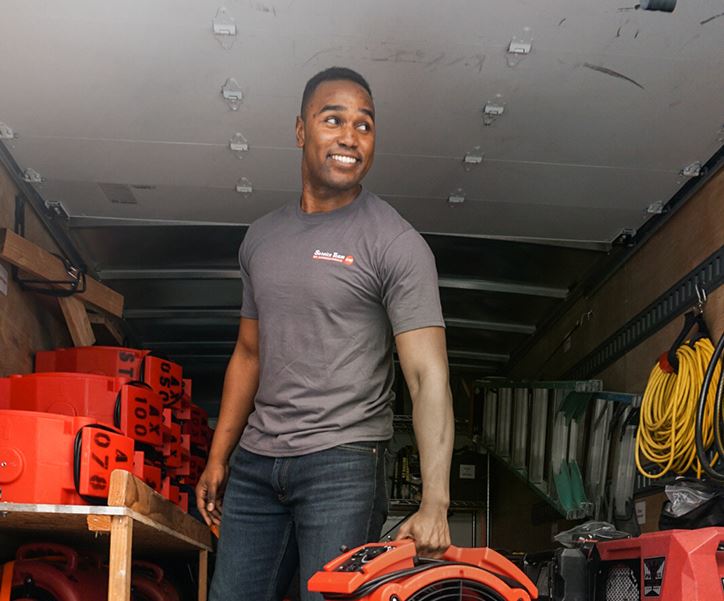 STOP Restoration employee carrying equipment